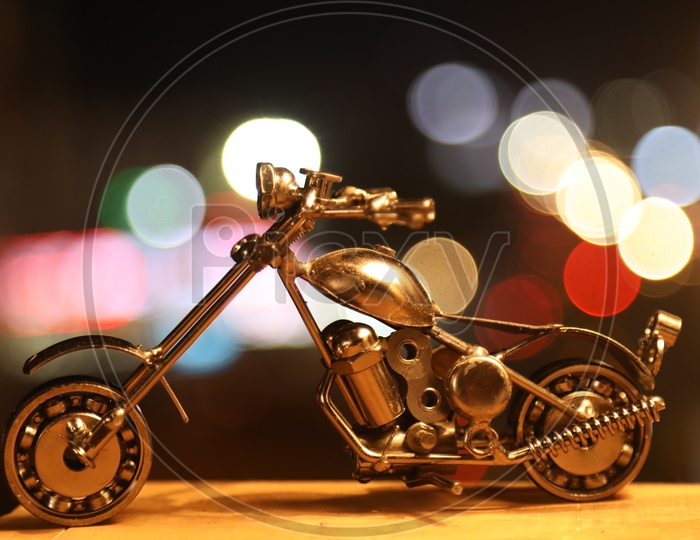 Metal miniature bike with bokeh effect