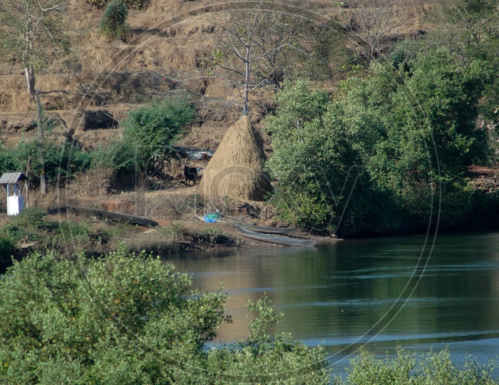 Hay stack besides a river