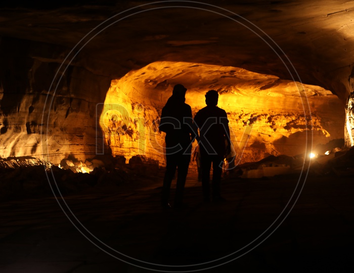 Silhouette of men in the cave