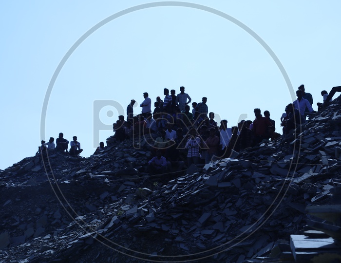 People on the top of the Black stone mining area
