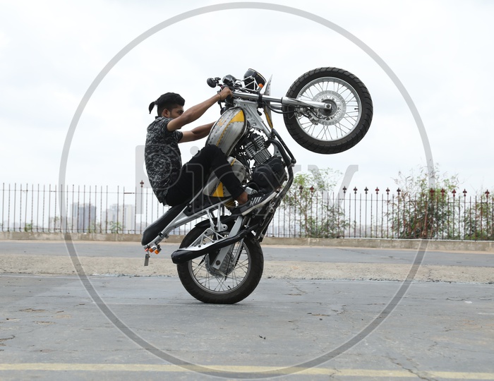 Stunt Man Performing Bike Stunts