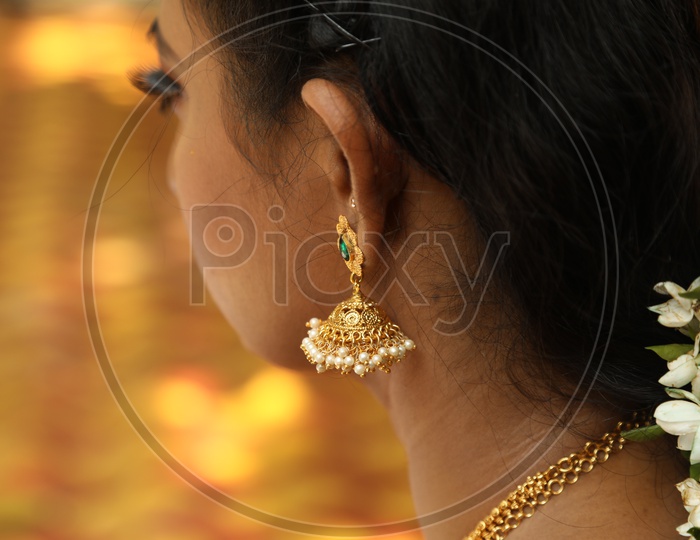 Close up shot of jhumka on indian women ear