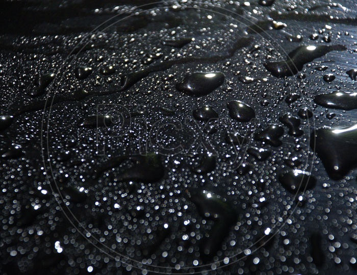 Water droplets black abstract background