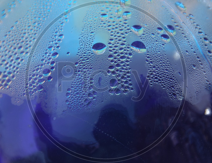 Water droplets blue abstract background