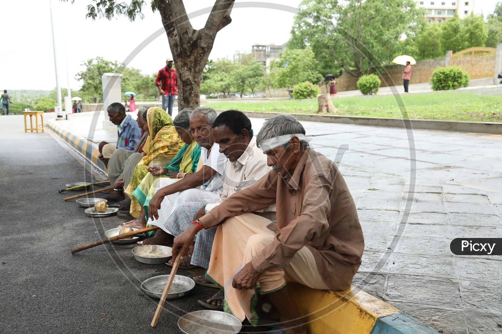 Beggars Sitting On a Footpath