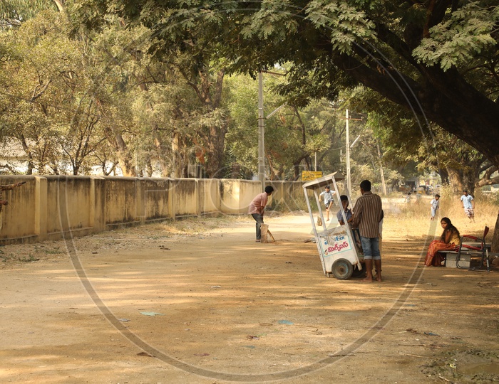 Children playing cricket in the street road