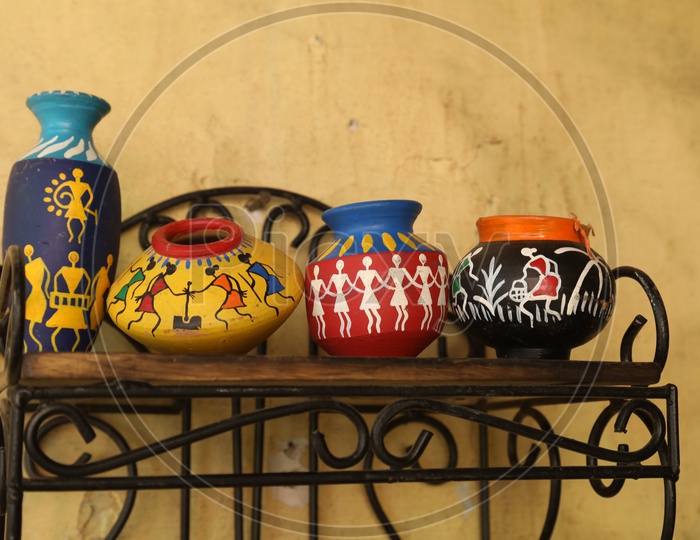 Painted pots on the shelf
