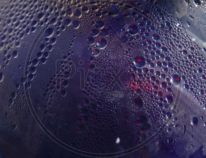 Water droplets blue abstract background