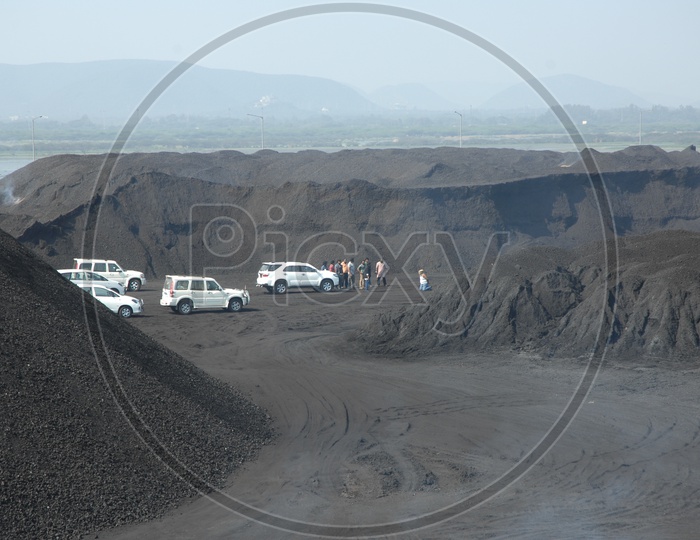 Goons hooting a Man in  Coal Mining Yard