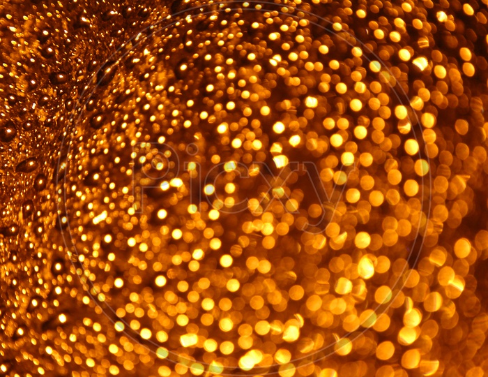 Water droplets golden yellow abstract background