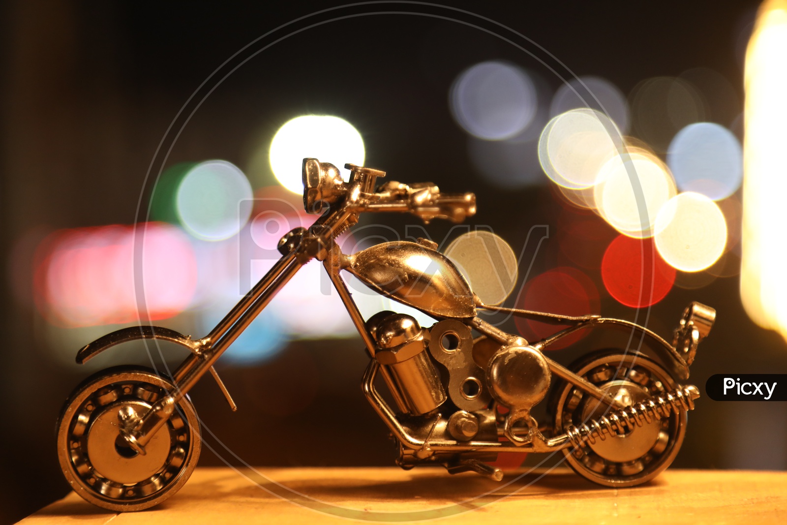 Metal miniature bike with bokeh effect