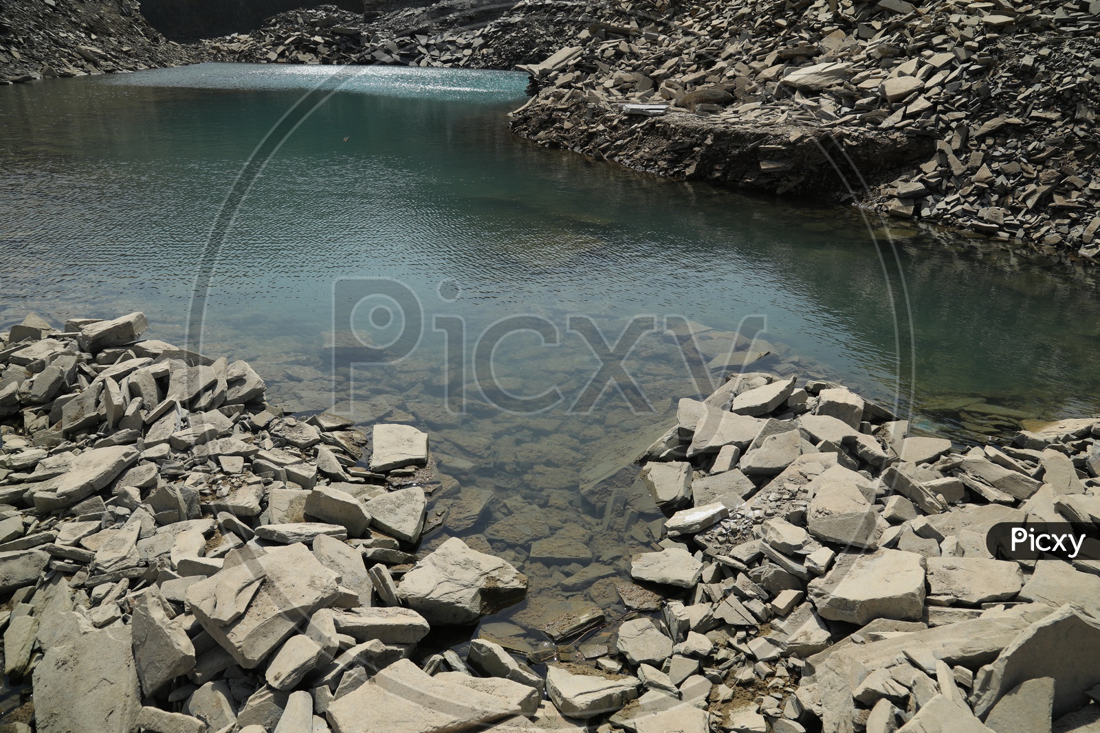 Water in a black stone mining area