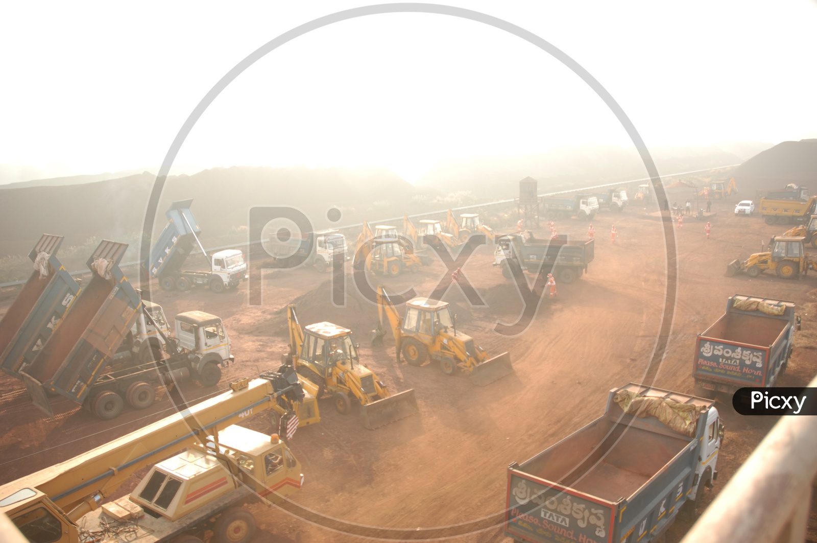 Goods Carrier Lorries And JCB Earth Movers In Mining Area