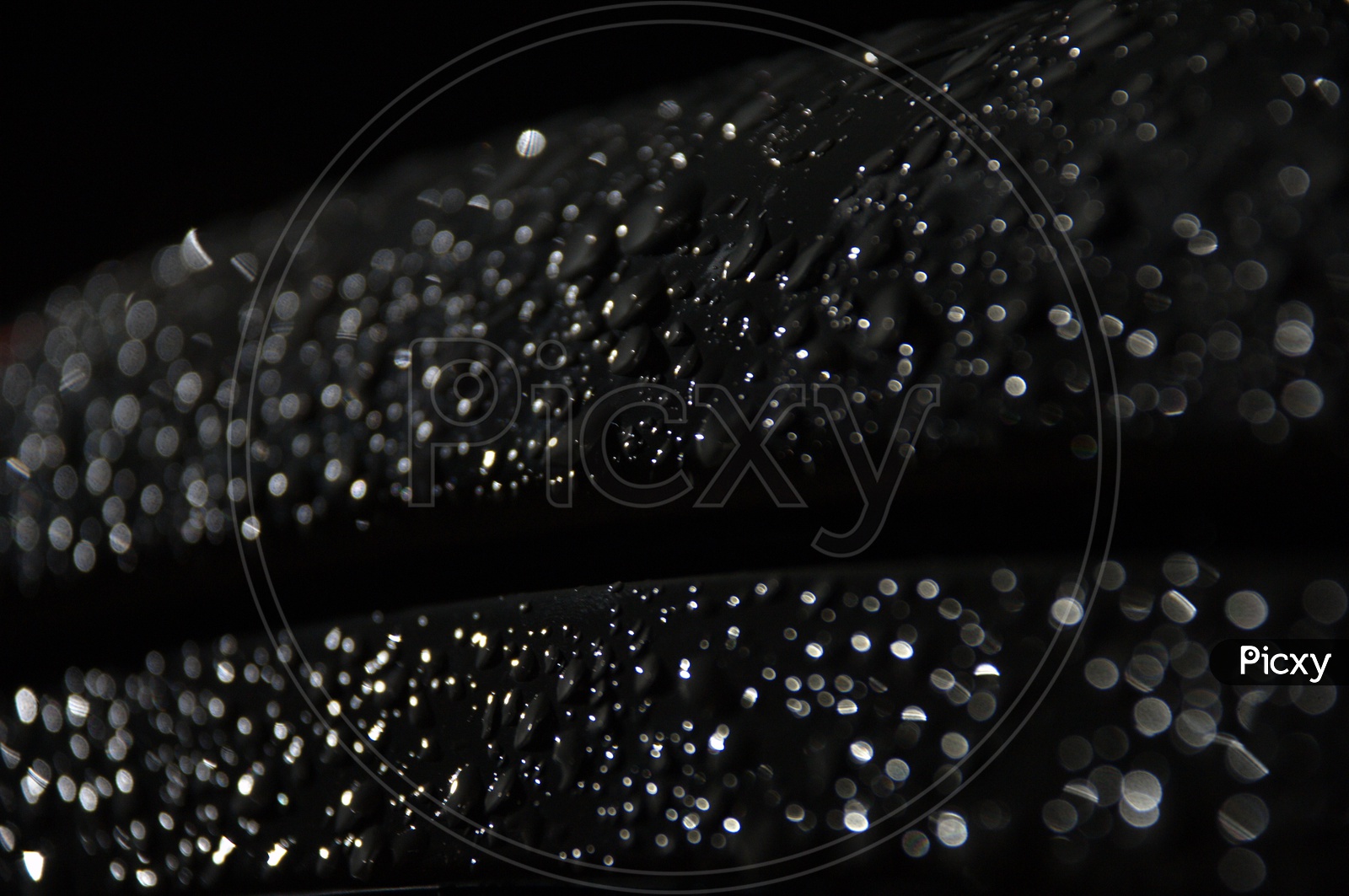 Water droplets black abstract background