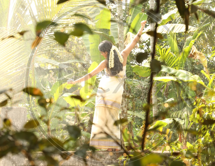 Kerala Girl In traditional Attire in woods