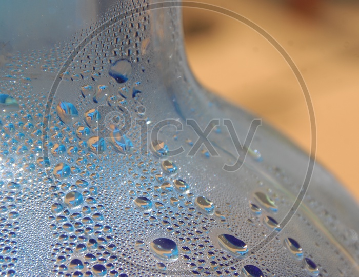 Water droplets inside a blue glass bottle
