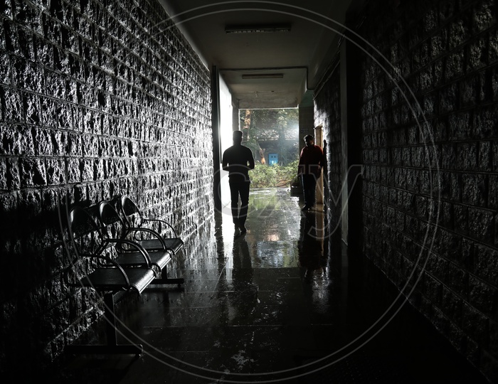 Silhouette Of a Man Walking In a Corridor