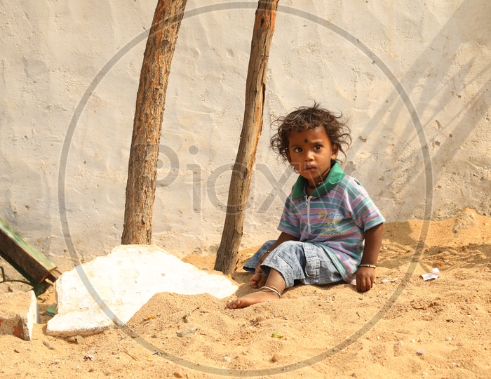 A Girl child playing in the sand