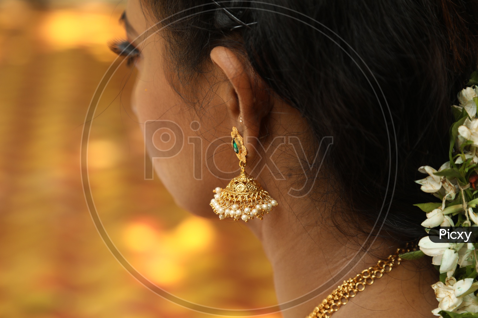 Close up shot of jhumka on indian women ear