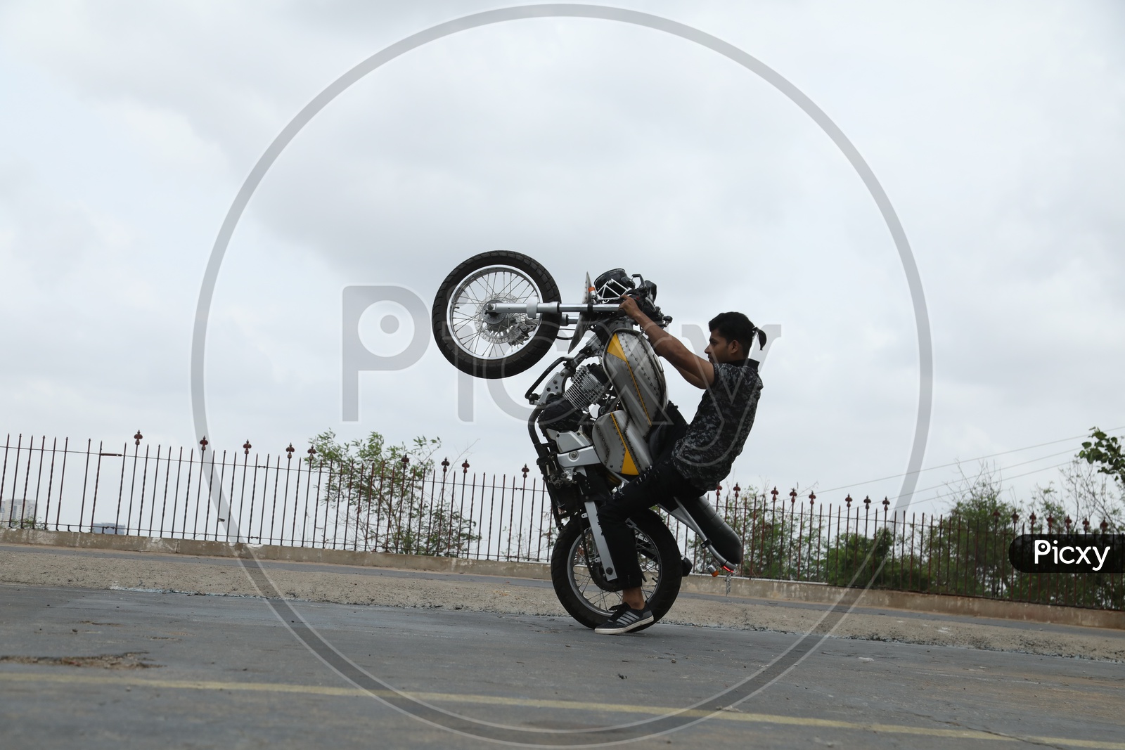 Biker Performing Stunts On Bike