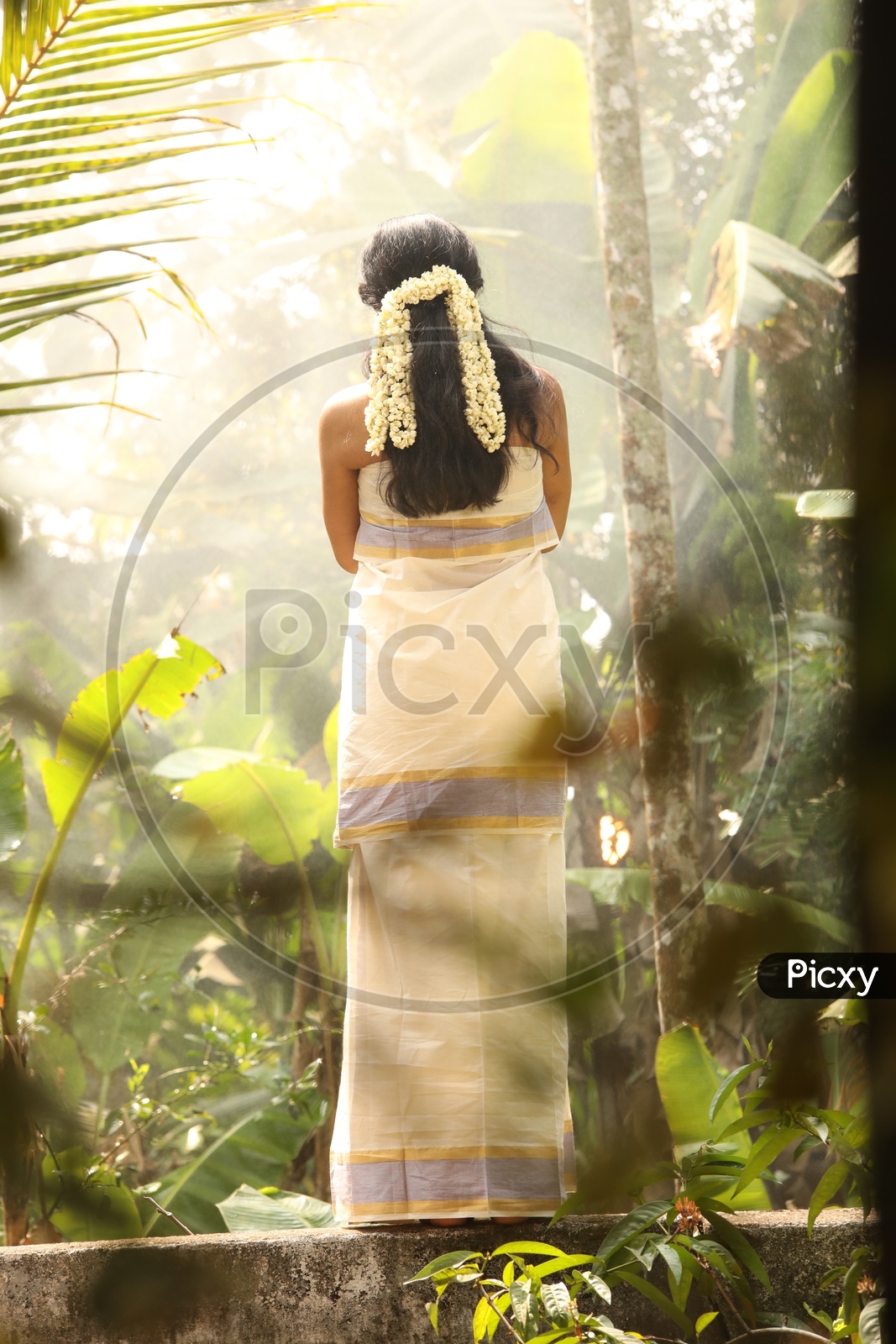 Onam Kerala women is on traditional dress | Traditional dresses, Kerala  traditional dress, Desi