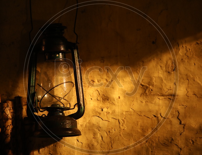Old lamp hanging to a wall
