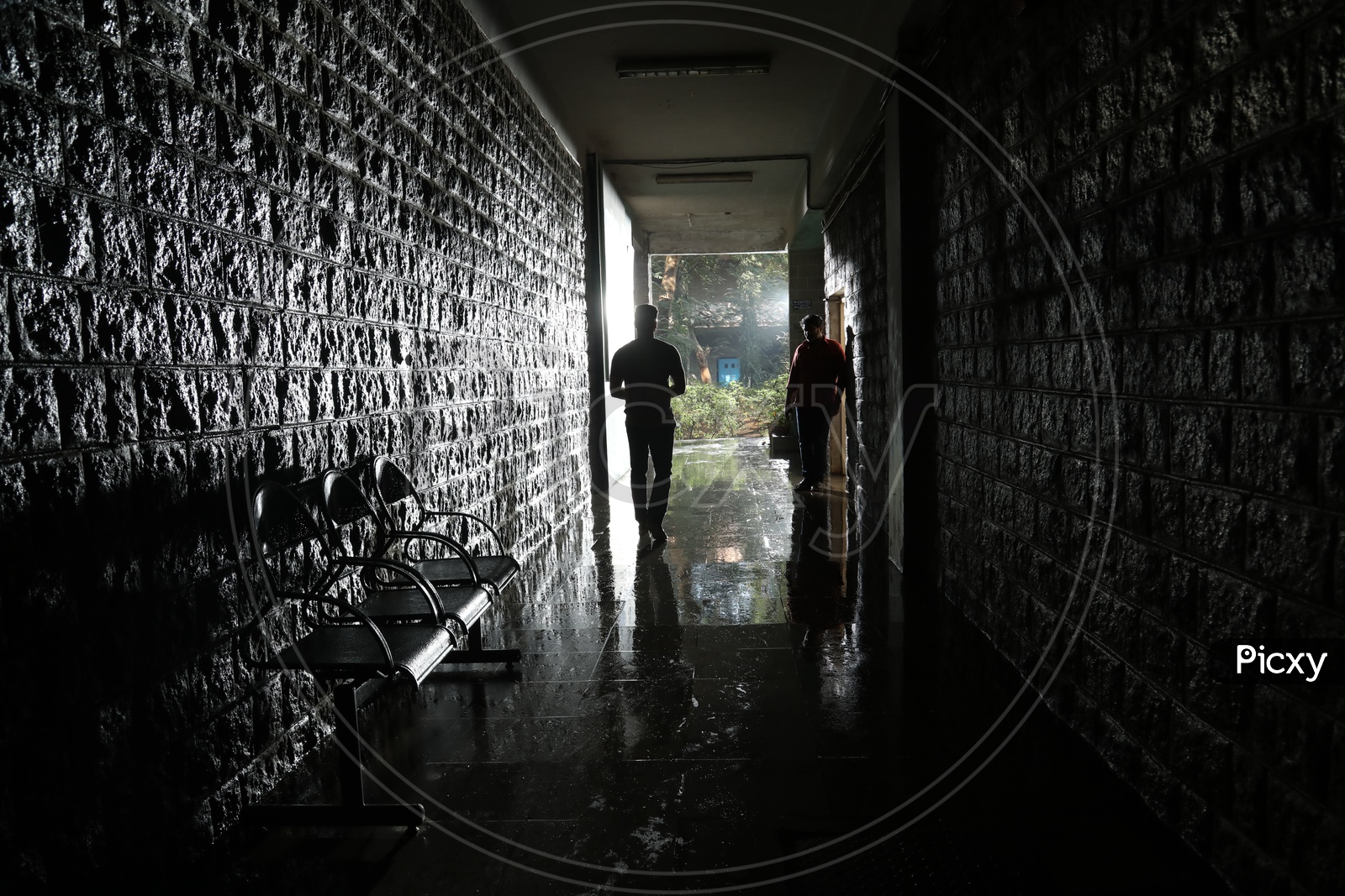 Silhouette Of a Man Walking In a Corridor