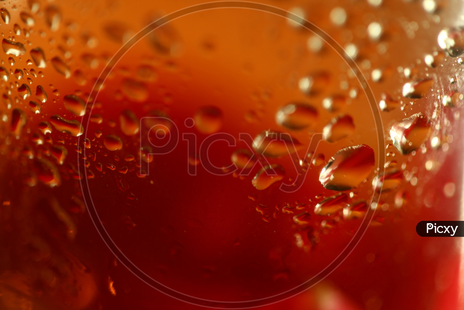Water droplets red abstract background