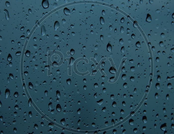 Water droplets on a glass surface abstract background