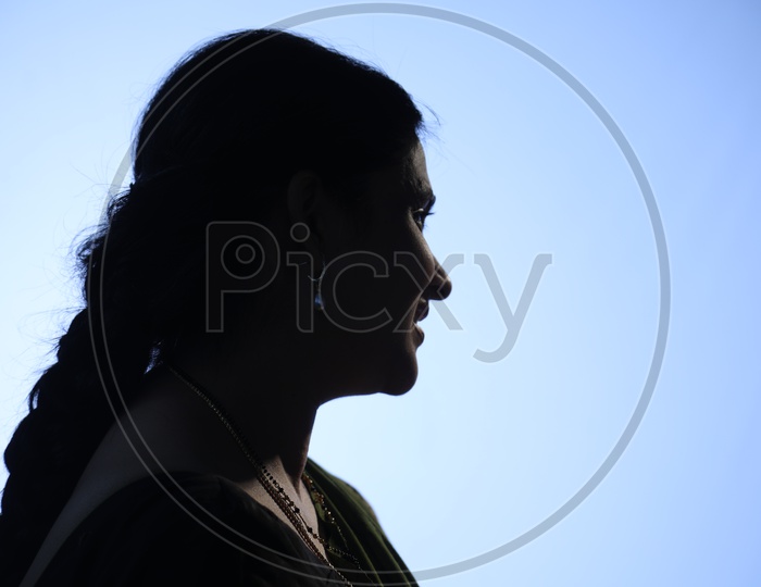 Silhouette of a smiling Indian woman
