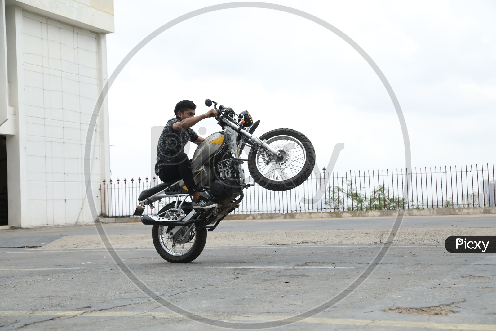 Stunt Man Performing Bike Stunts