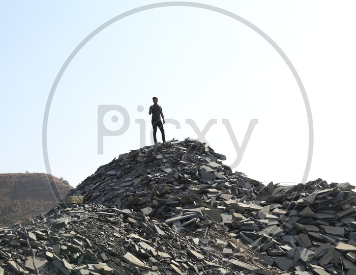 A man on the top of the Black stone mining area