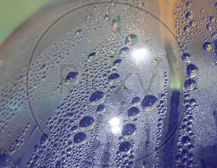 Water droplets inside a glass surface abstract background