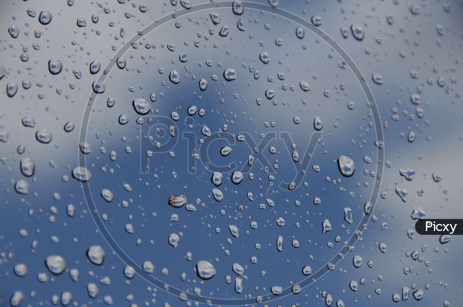 Water droplets light blue abstract background