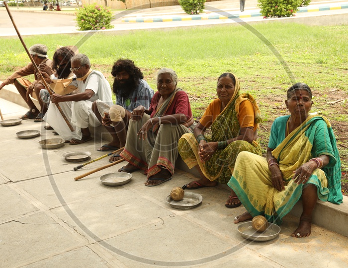 Beggars Sitting On A Road Side