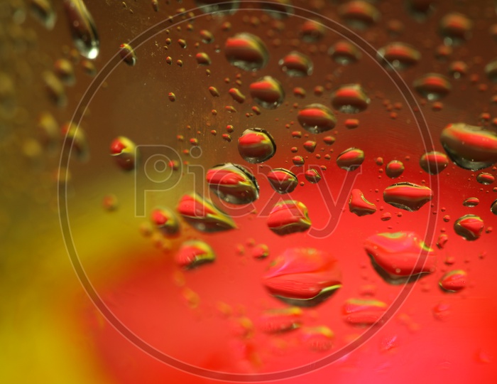 Water droplets red and yellow abstract background