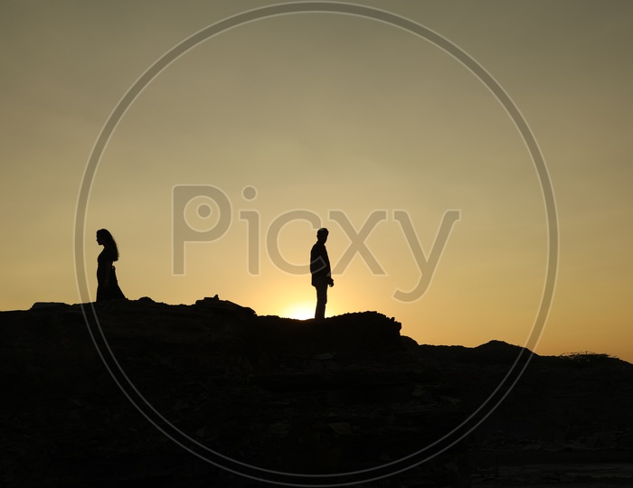 Silhouette of a couple with sun in background