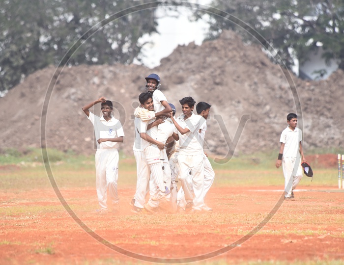 School cricket players celebrating