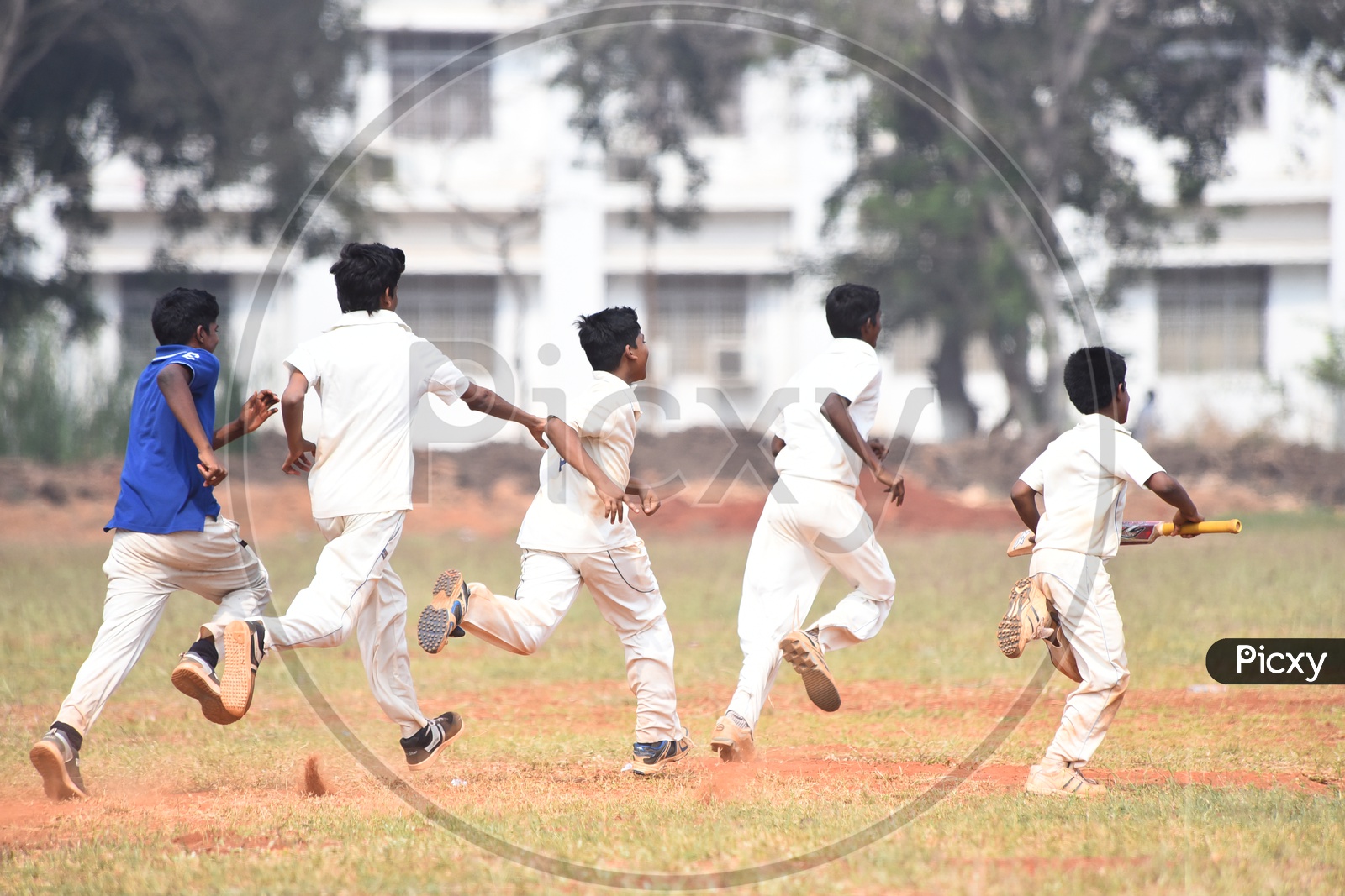 School kids celebrating victory  during cricket match