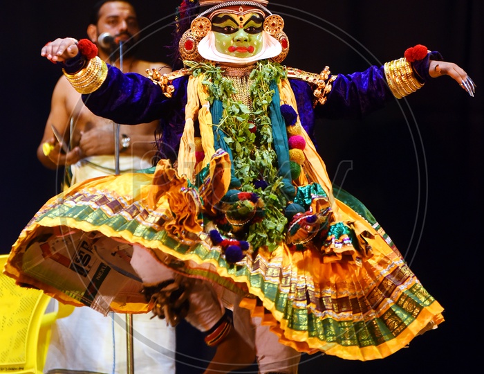 kathakali dancer performing on stage