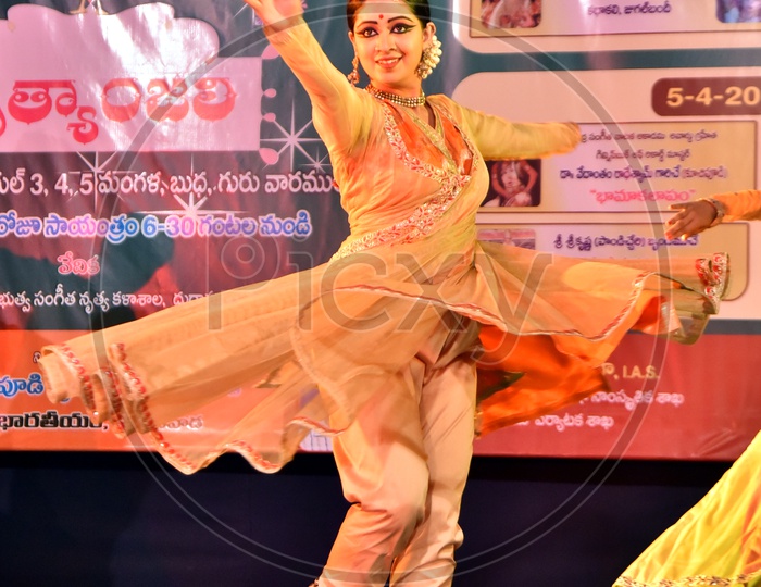 Artists performing Indian Classical Dance form Kathak on stage
