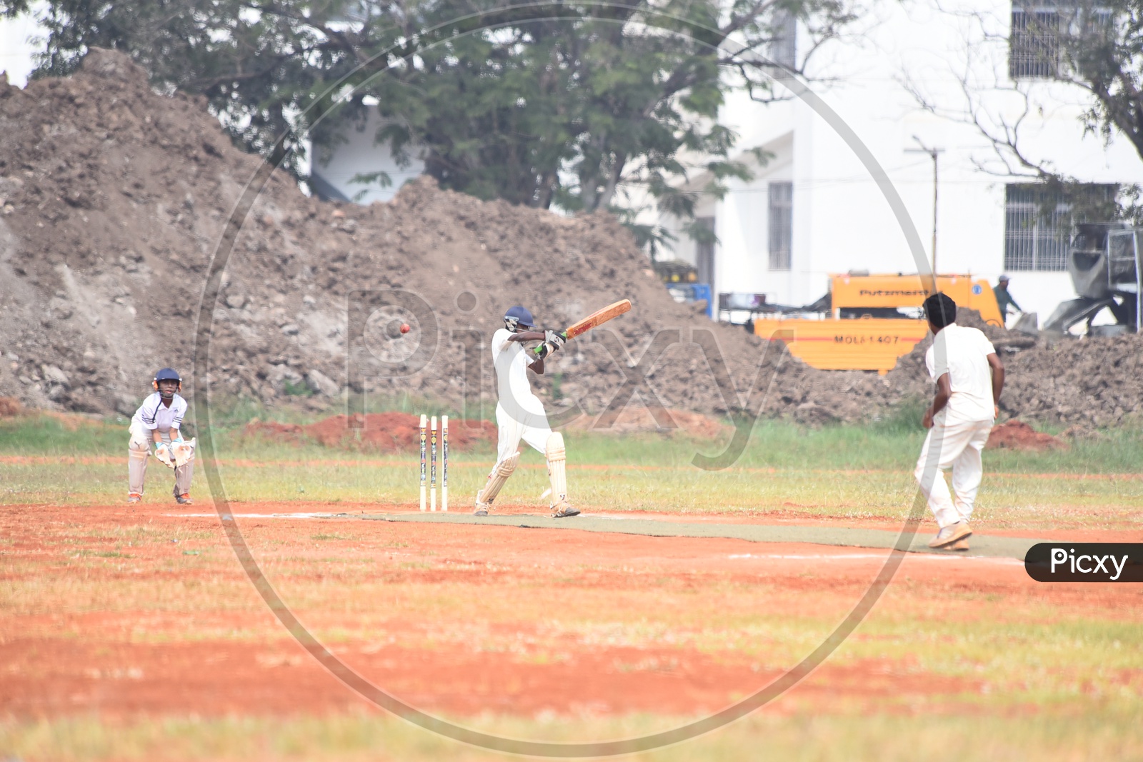 School cricket players playing in the ground