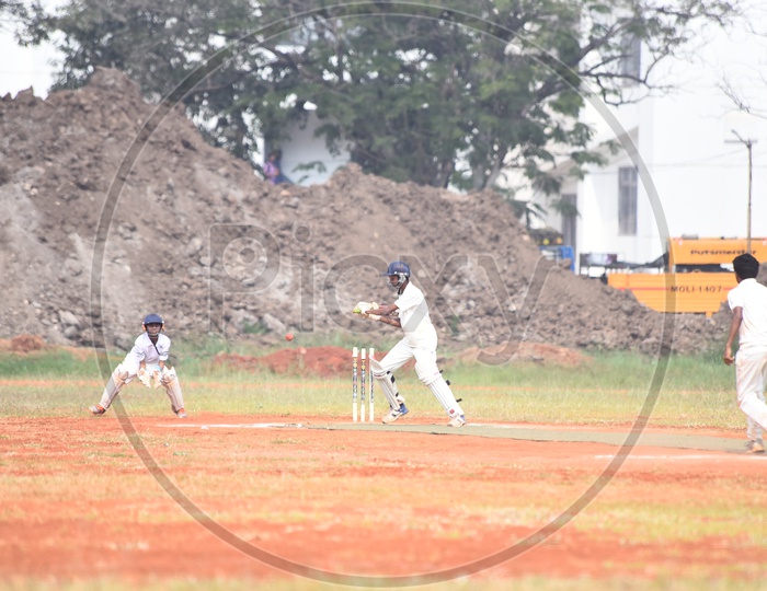 School cricket players playing in the ground