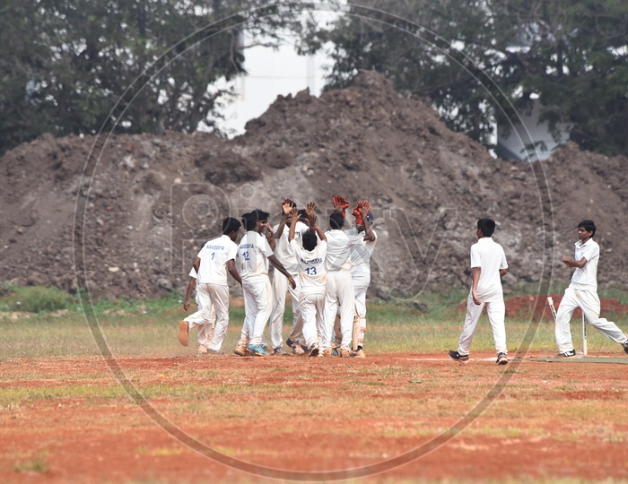 School Kids celebrating for the fall of wicket
