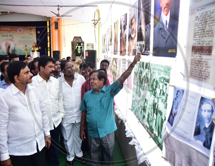 Devineni Uma, AP Irrigation Minister observing the photos