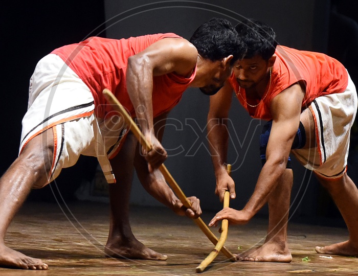 Artists performing Indian Martial Arts on stage