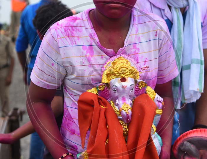 Kid with his Ganesha Idol during Ganesh Visarjan