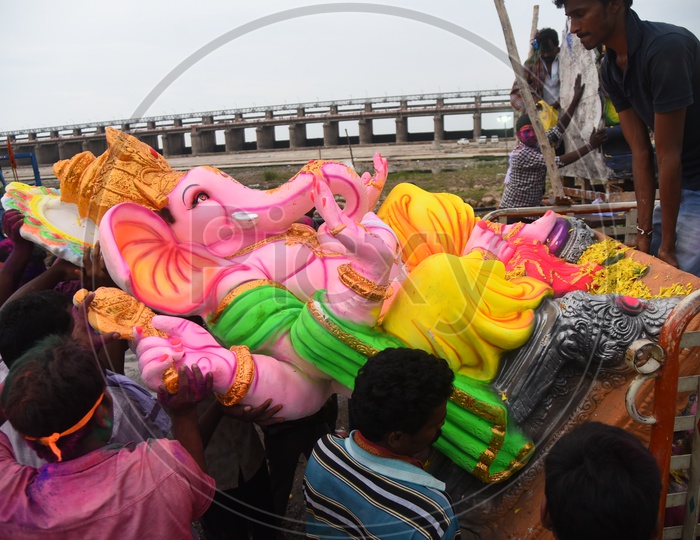 Men carrying the Ganesha Idol during Ganesh Visarjan
