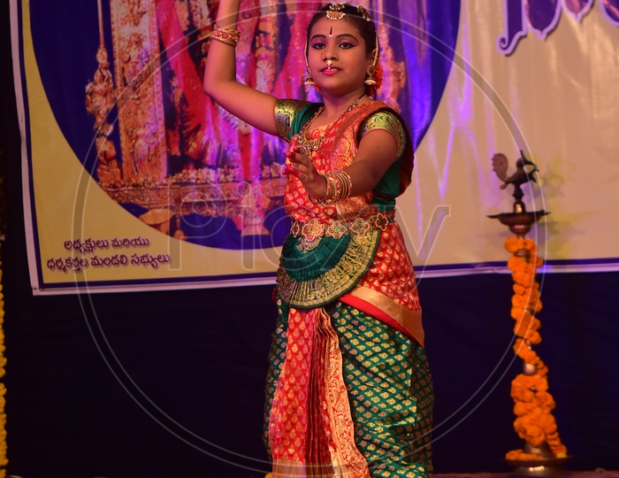 Artist performing Indian Classical Dance Kuchipudi on Stage