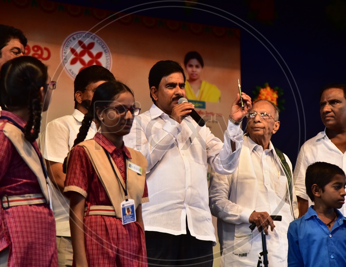 Devineni Uma, AP Irrigation Minister awarding the school girl